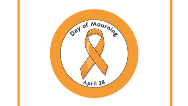 National Day of Mourning An orange circle with an orange ribbon inside signifying the National Day of Mourning
